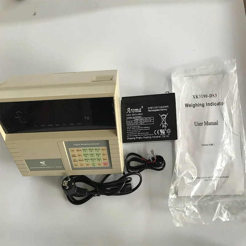 XK3190-DS3 digital weighing indicator photographed with power accessories and user manual