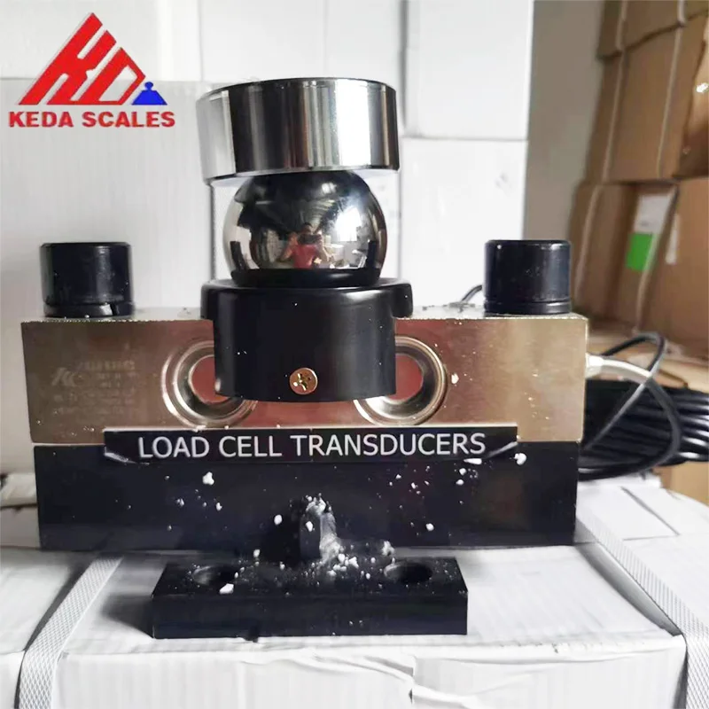 Front photo of the HM9B 30 ton analog load cell showing the spherical load-bearing assembly and mounting base